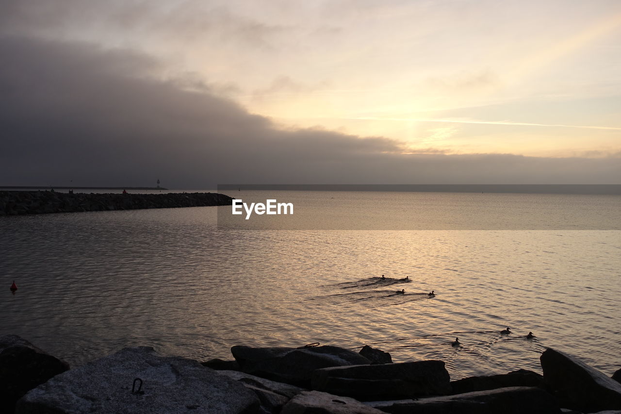 SCENIC VIEW OF SEA DURING SUNSET