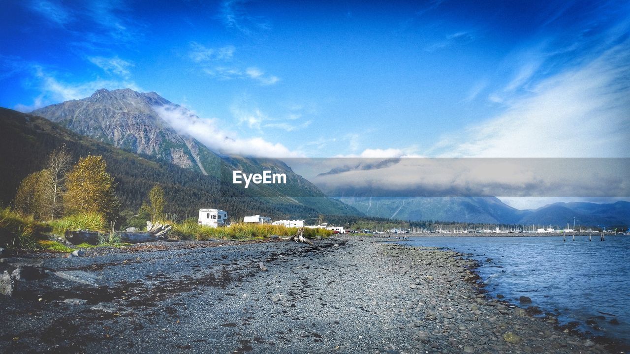 SCENIC VIEW OF MOUNTAINS AGAINST BLUE SKY