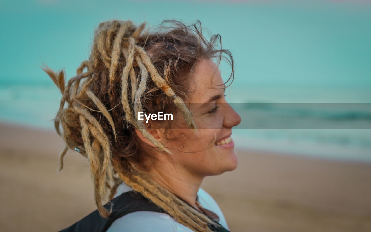 Portrait of smiling person on beach