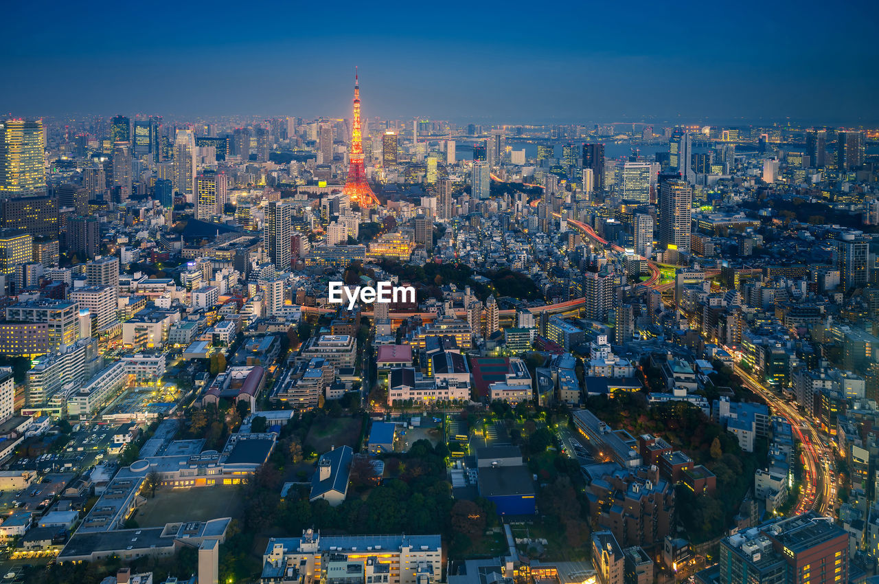 AERIAL VIEW OF ILLUMINATED CITYSCAPE