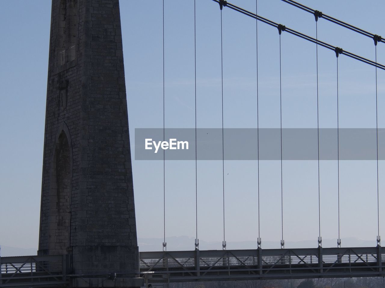 LOW ANGLE VIEW OF SUSPENSION BRIDGE