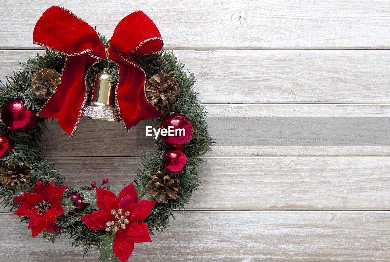Close-up of christmas wreath on wooden table