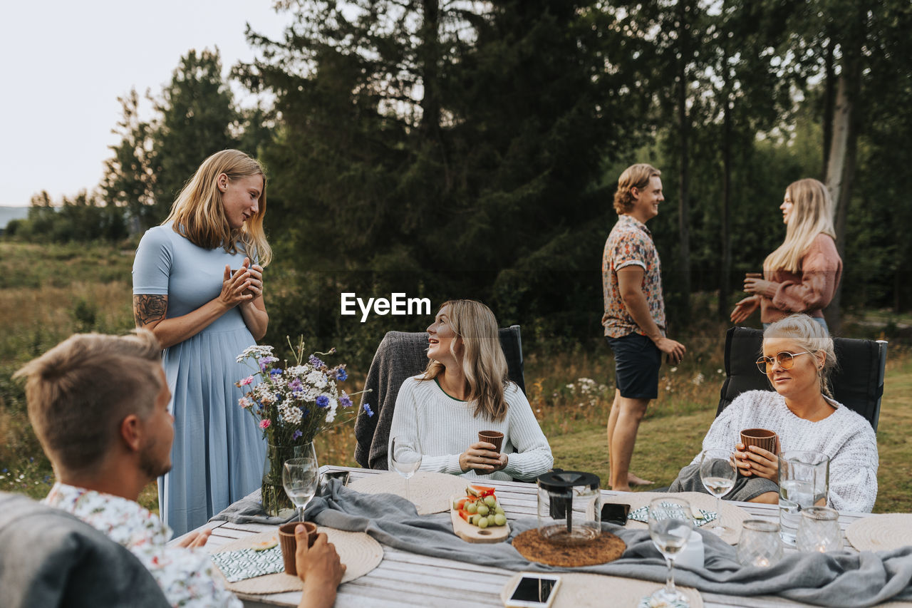 Friends talking in garden