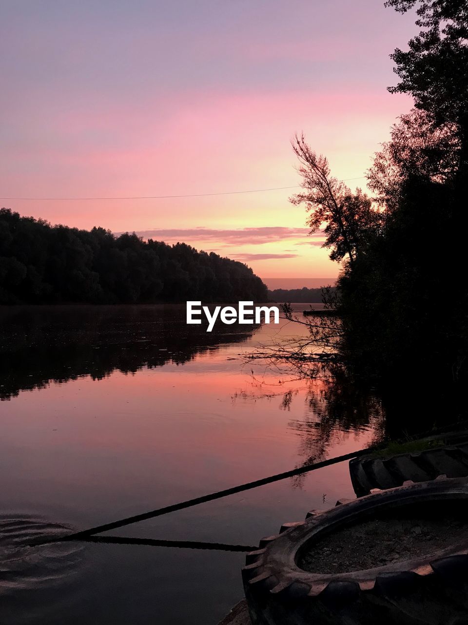 SCENIC VIEW OF LAKE DURING SUNSET