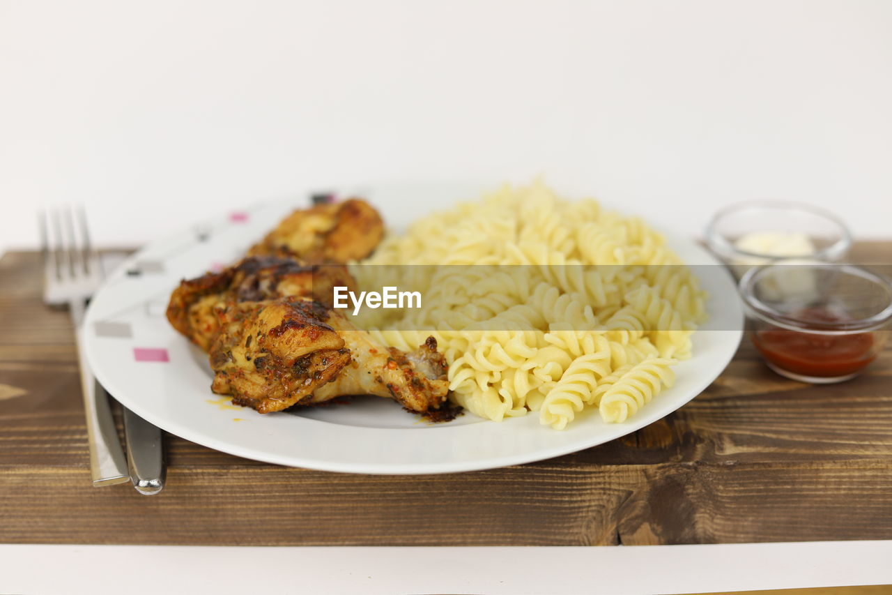 food and drink, food, plate, dish, breakfast, cuisine, meal, healthy eating, produce, indoors, freshness, no people, table, wellbeing, wood, eating utensil, kitchen utensil, fork, vegetable, studio shot, meat, household equipment, still life