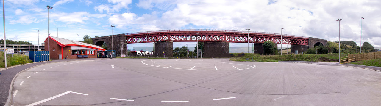 BRIDGE OVER ROAD AGAINST SKY