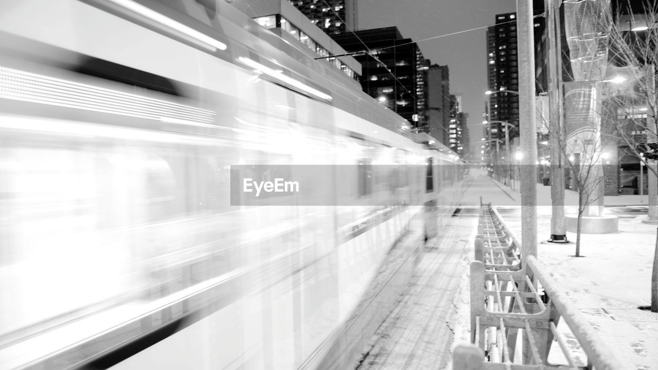 BLURRED MOTION OF TRAIN IN CITY