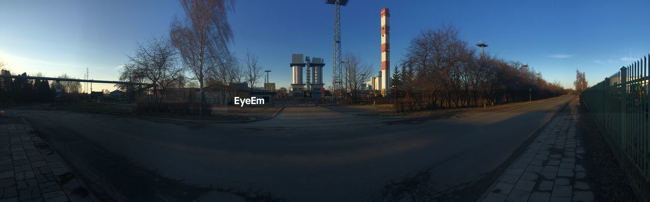 PANORAMIC VIEW OF FACTORY AGAINST SKY
