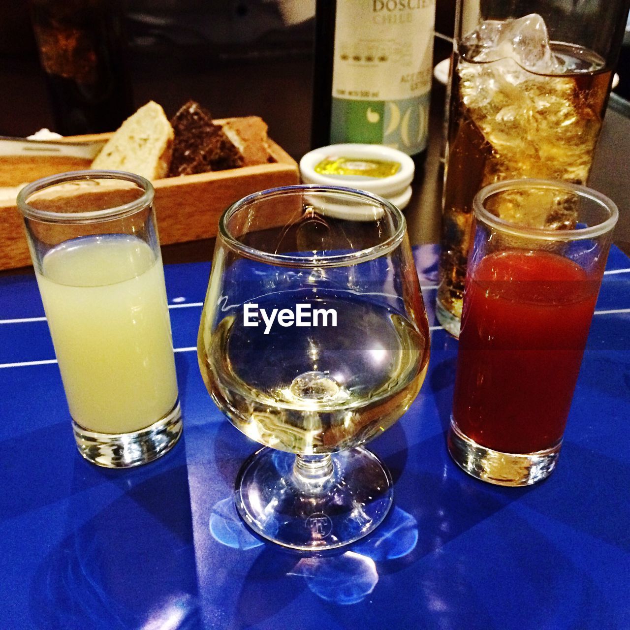 CLOSE-UP OF BEER GLASS ON BAR