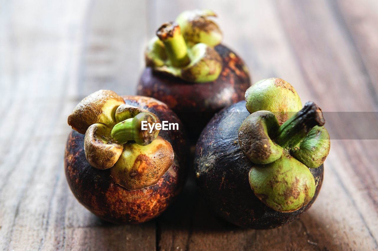 Close-up of mangosteens on table