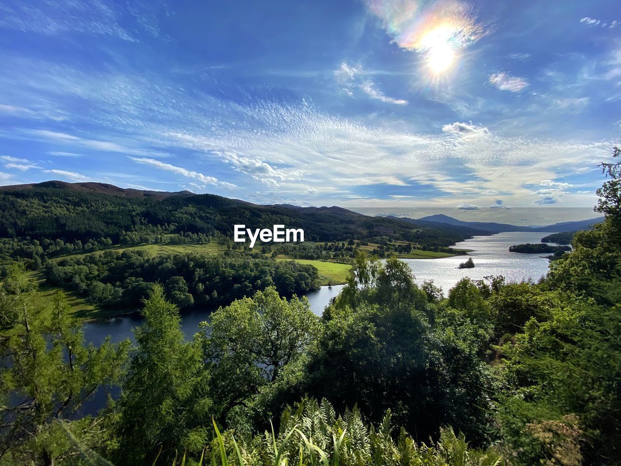 SCENIC VIEW OF LAKE AGAINST LANDSCAPE