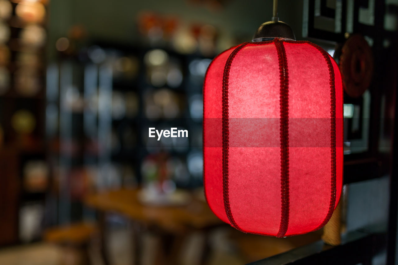 Close-up of illuminated lanterns hanging in restaurant