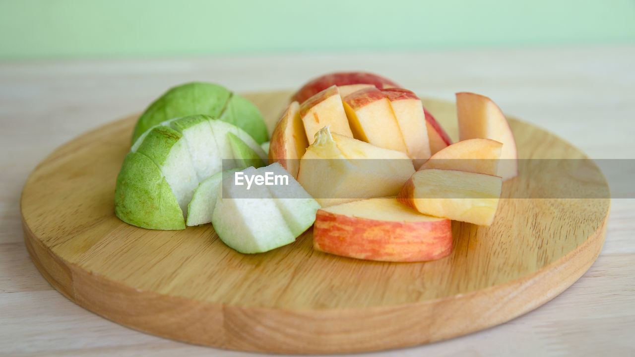 CLOSE-UP OF FRUITS ON TABLE