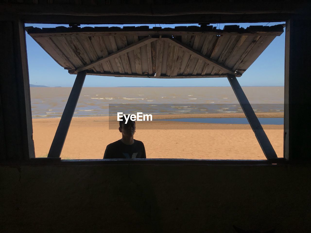 Portrait of man standing on beach