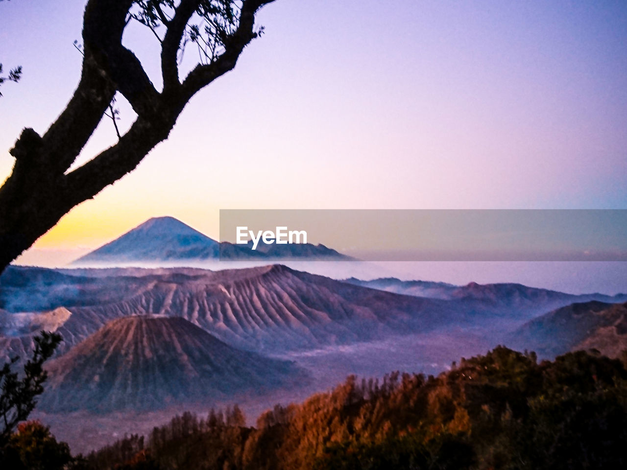 Scenic view of mountains against sky during sunset