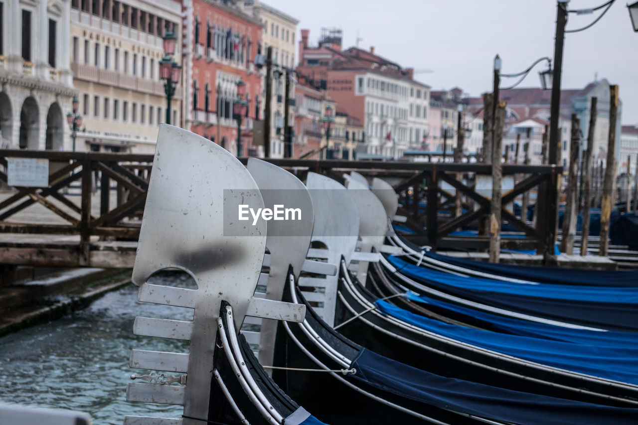 Gondolas tied up at the pier on st. mark's square.