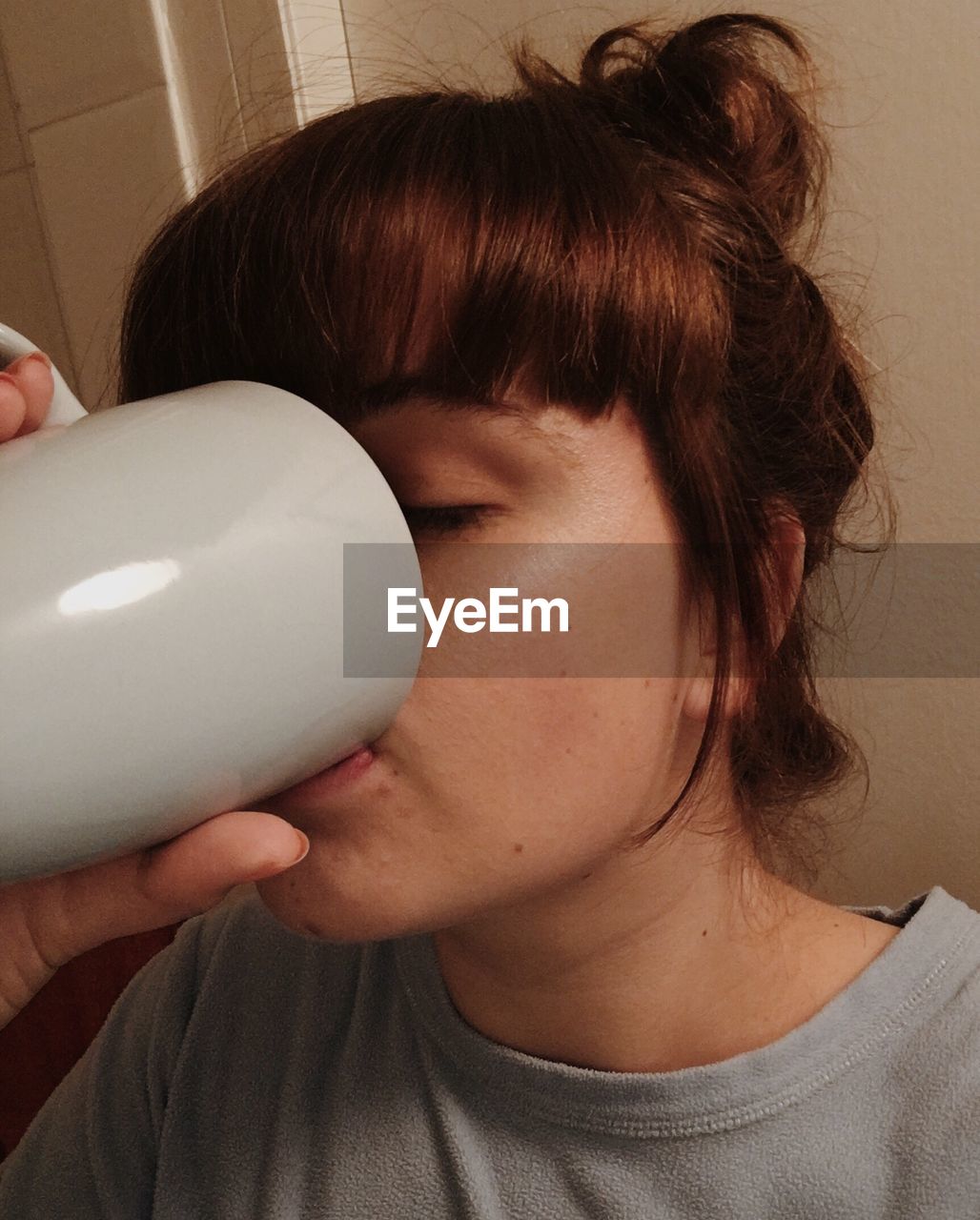 Close-up of woman drinking coffee