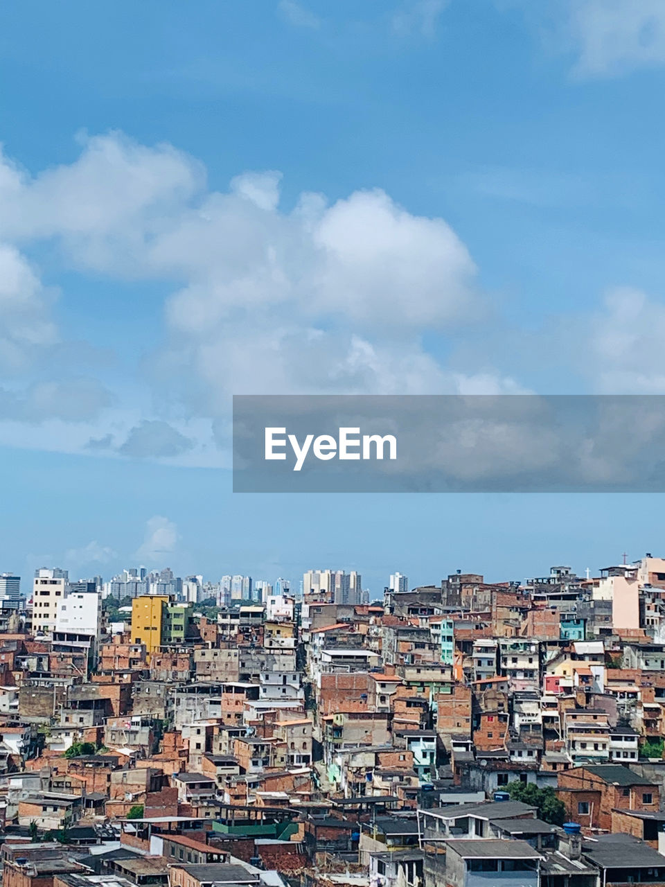 HIGH ANGLE VIEW OF HOUSES AGAINST SKY