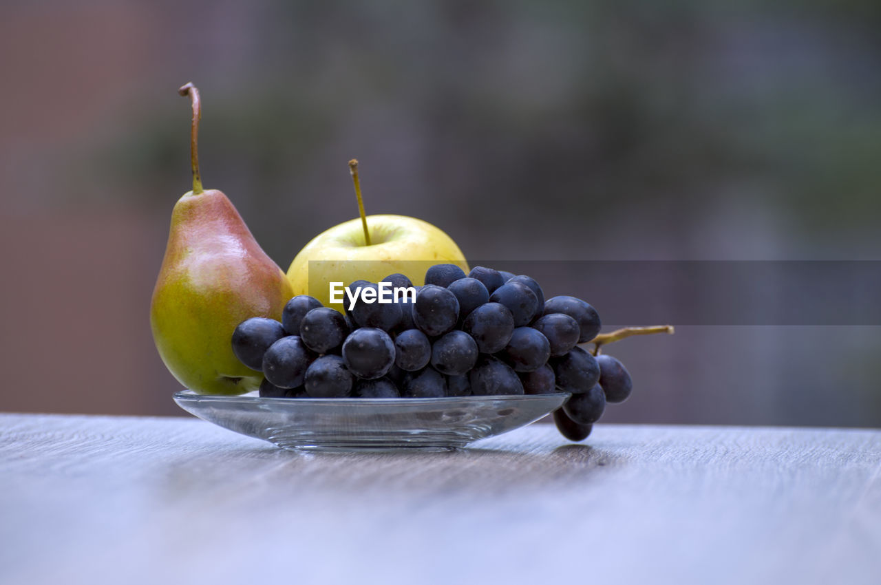 FRUITS IN BOWL ON TABLE