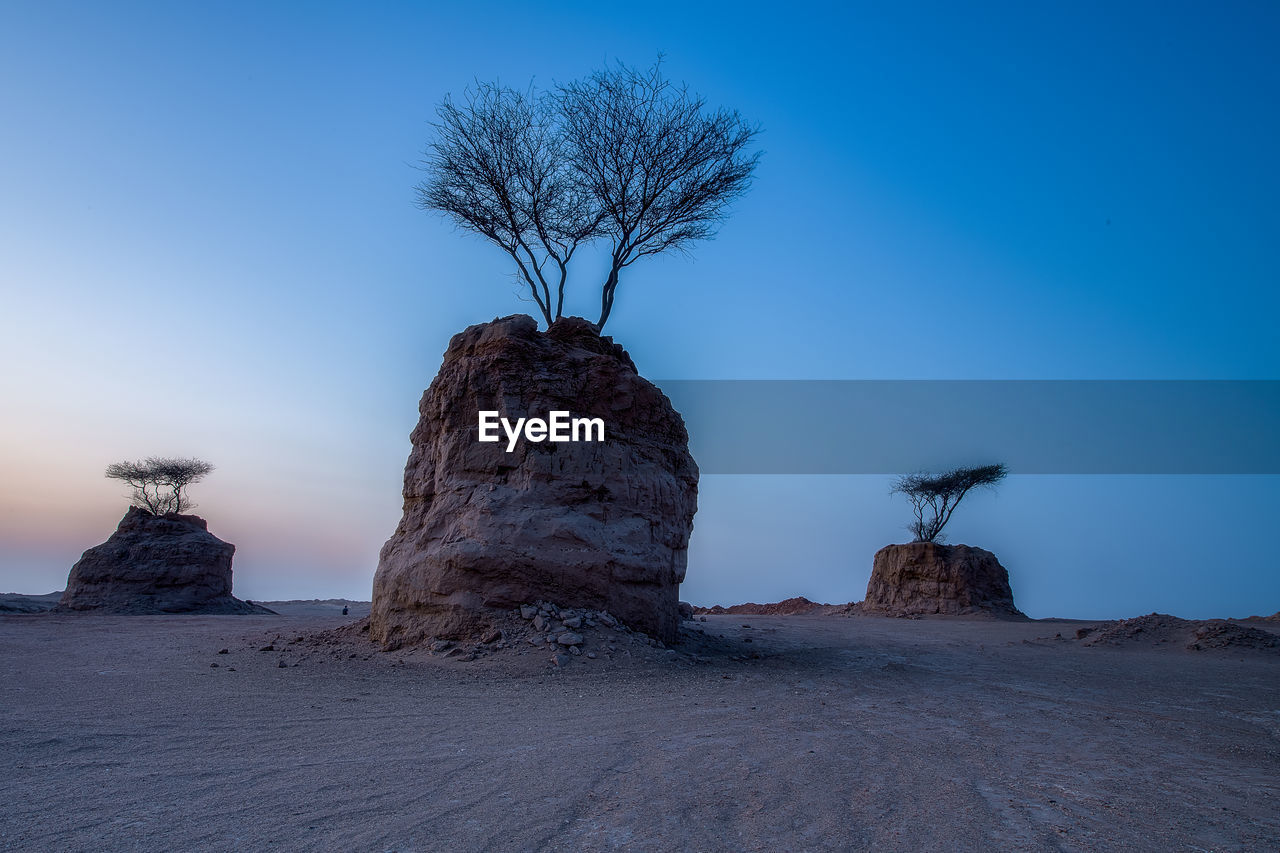 VIEW OF ROCK FORMATIONS AGAINST SKY