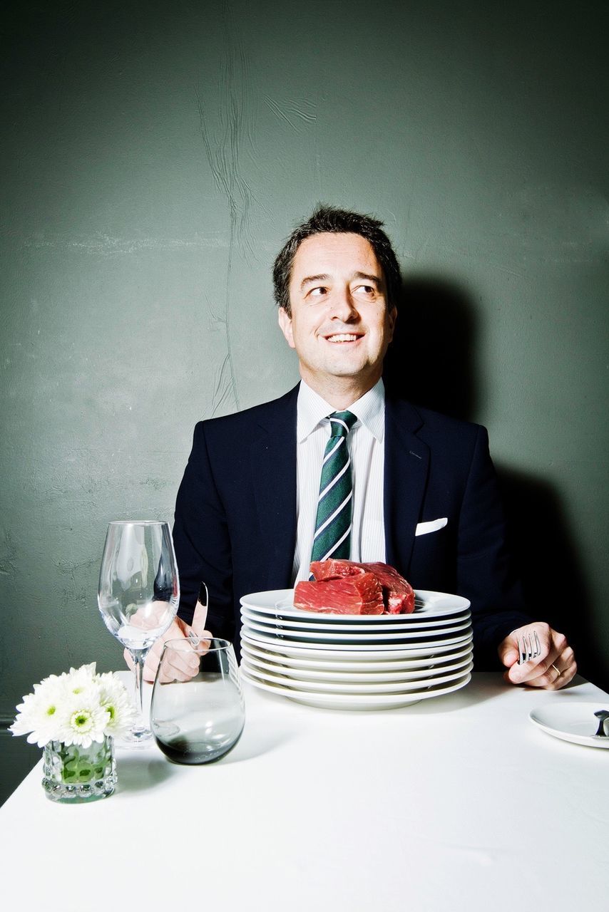 Businessman sitting on dining table