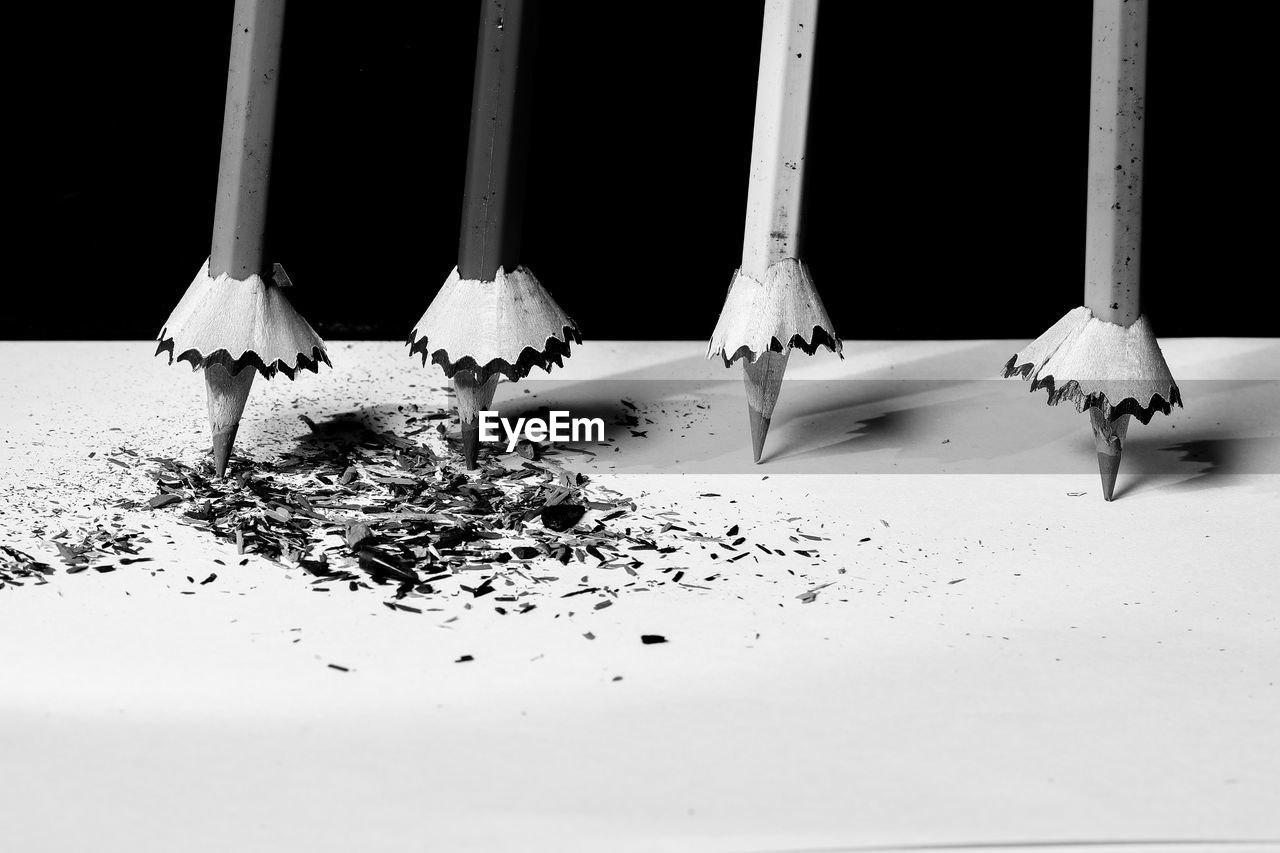 Close-up of snow on floor against white background