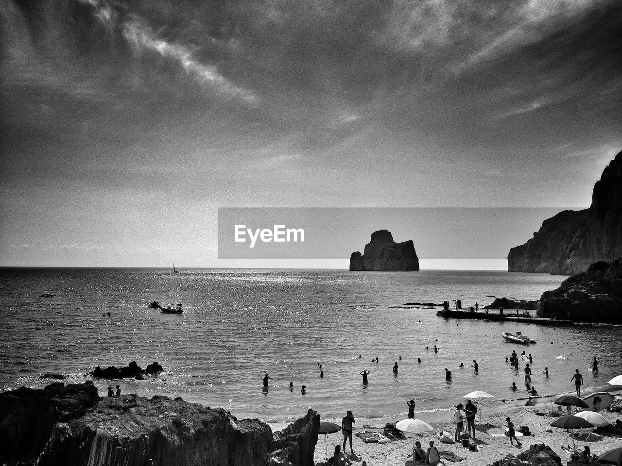 SCENIC VIEW OF SEA WITH ROCKS IN BACKGROUND