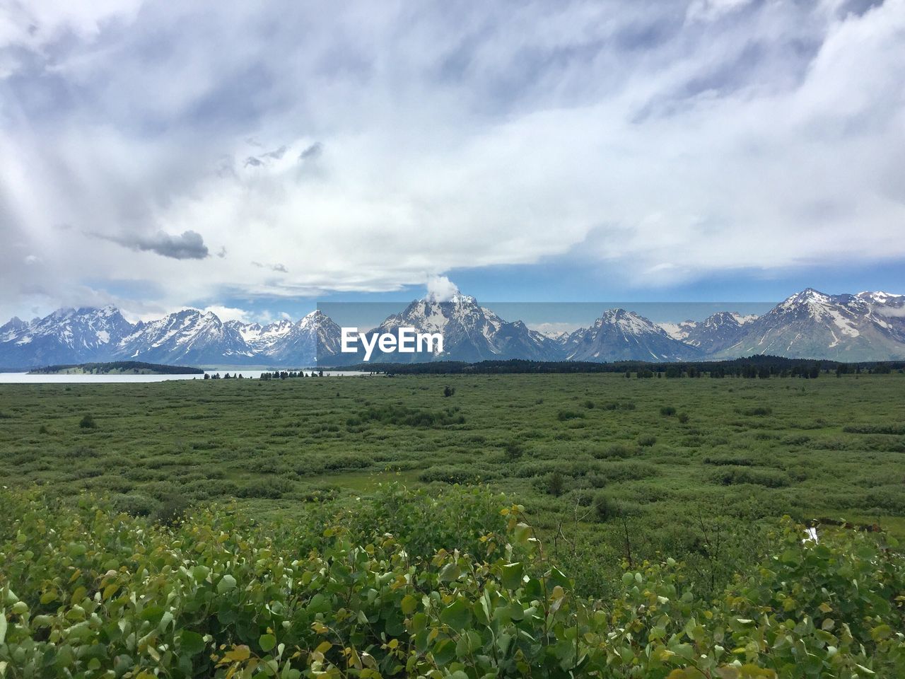 SCENIC VIEW OF LANDSCAPE AND MOUNTAINS AGAINST SKY