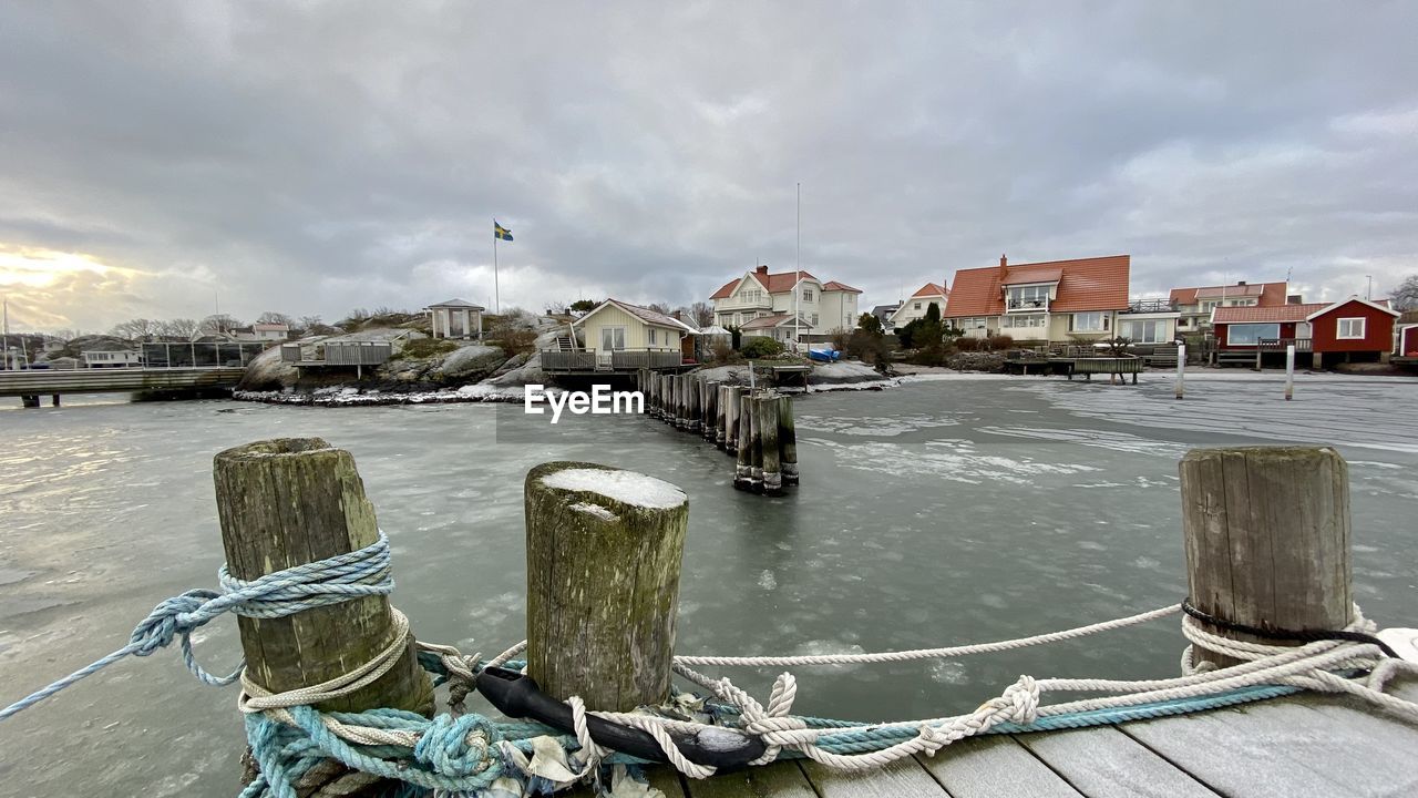 Ice on the sea in a small harbor with houses