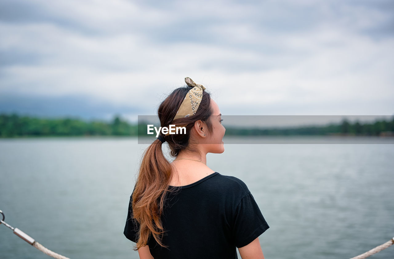 Back view point of young women standing and looking at far away ,freedom ,calm ,mindfulness concept