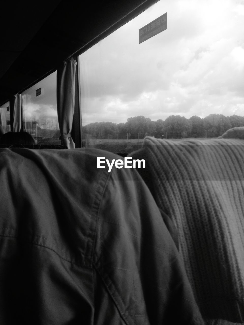 VIEW OF TRAIN AGAINST CLOUDY SKY