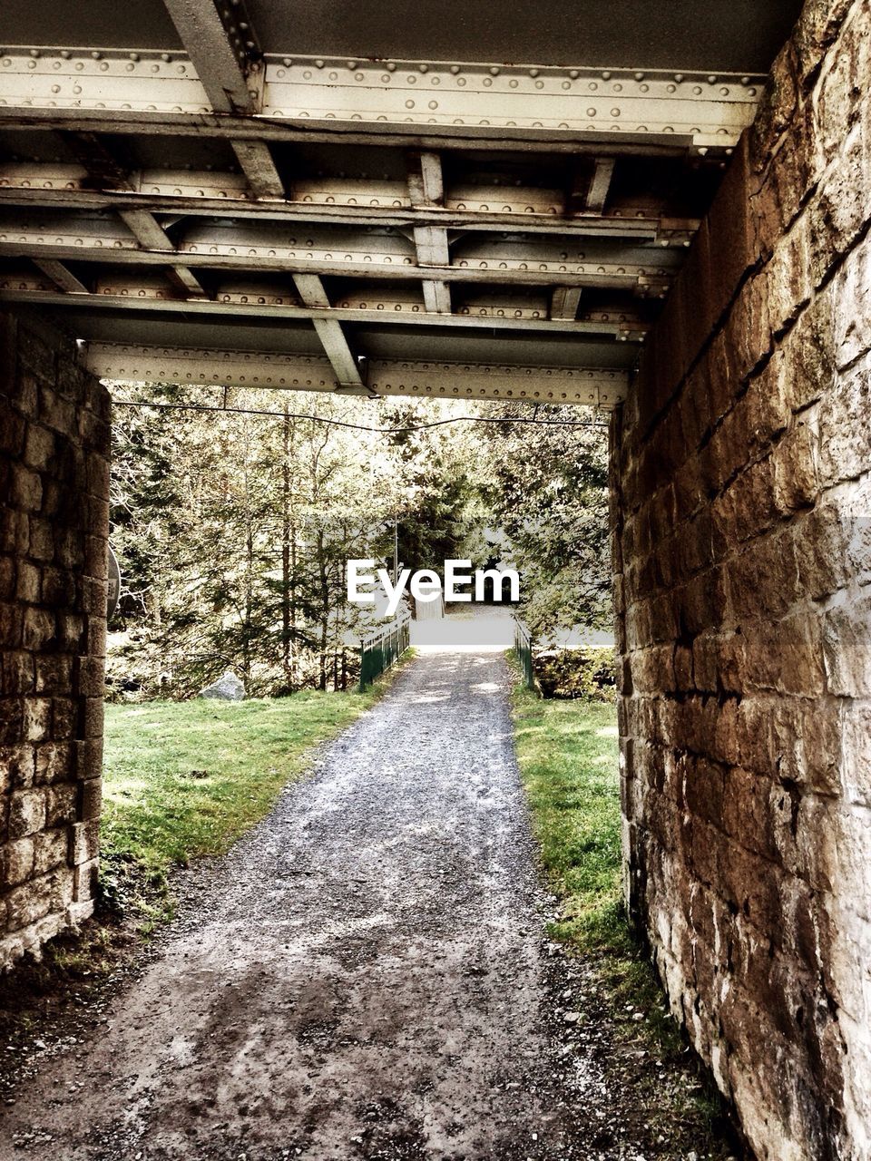 Bridge above dirt road