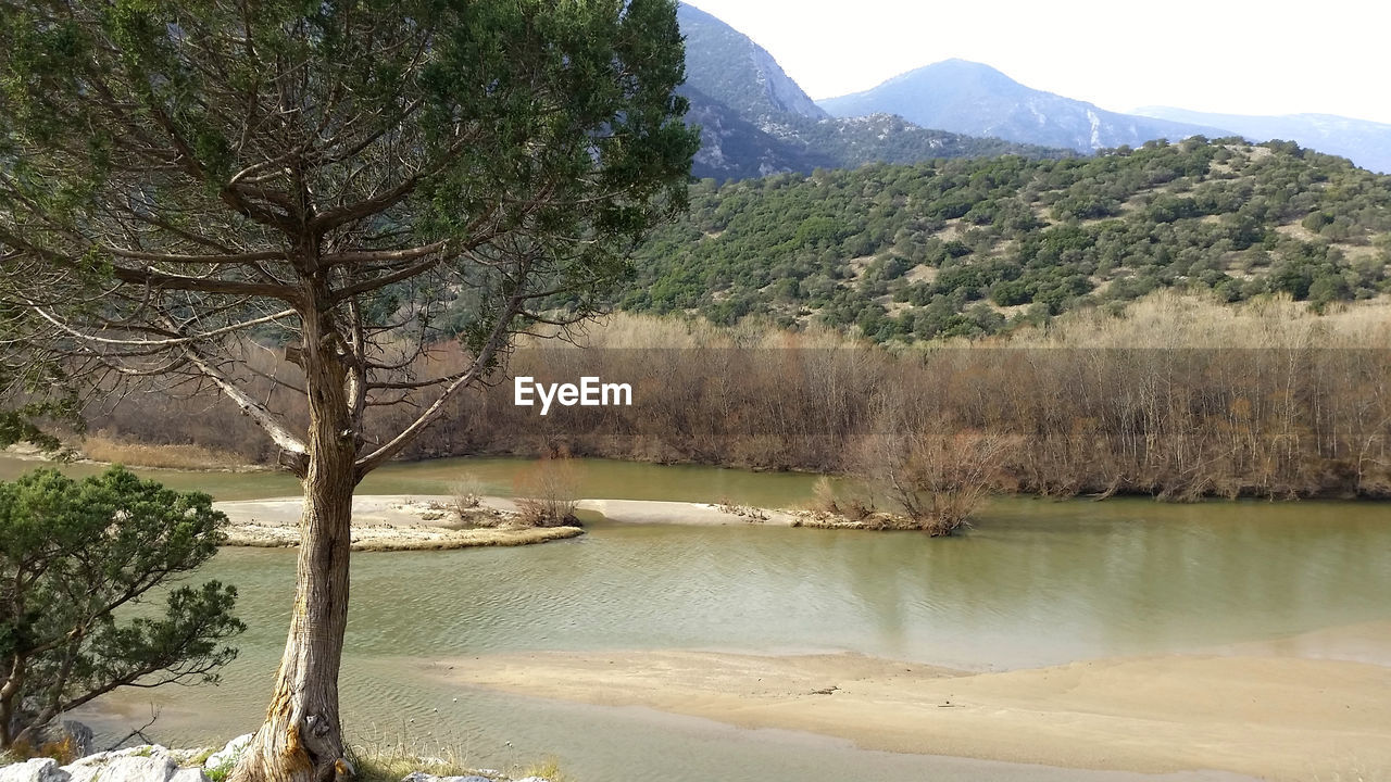 Scenic view of river and mountains