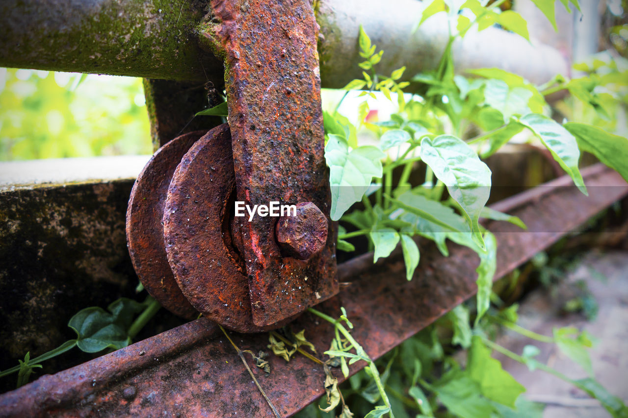 Close-up of rusty metallic train on tracks