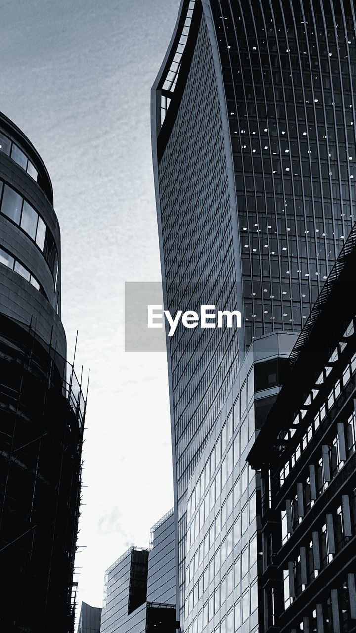 LOW ANGLE VIEW OF MODERN BUILDINGS