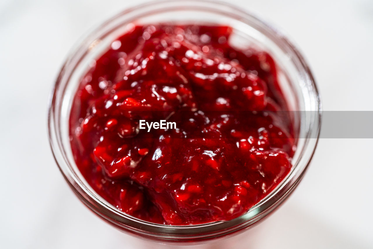 food and drink, plant, food, berry, red, fruit, raspberry, healthy eating, cranberry, indoors, sweet food, produce, preserves, no people, freshness, studio shot, pomegranate, close-up, high angle view, wellbeing, container, directly above, household equipment, refreshment, glass, drink