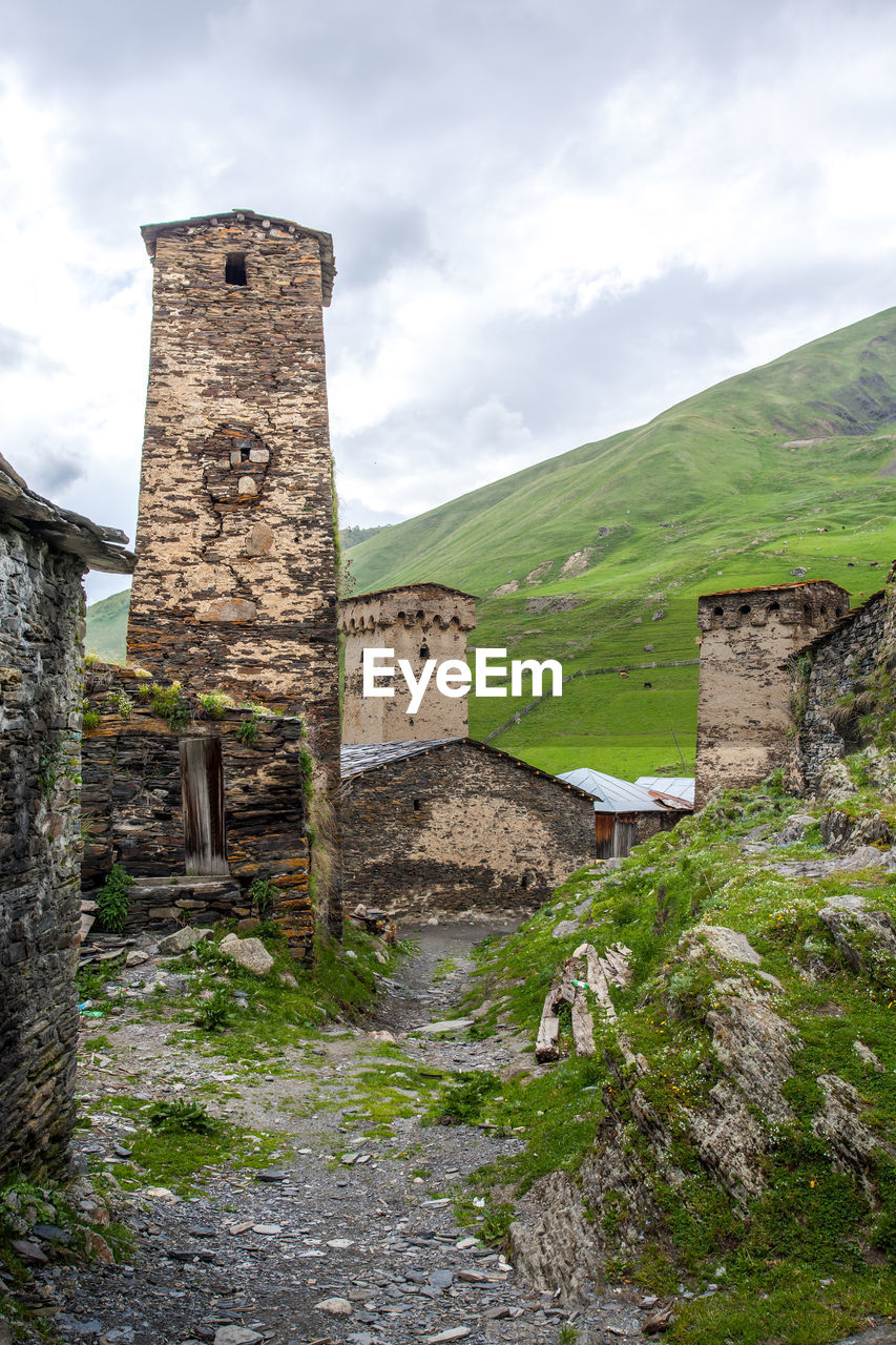 OLD RUINS AGAINST BUILDING