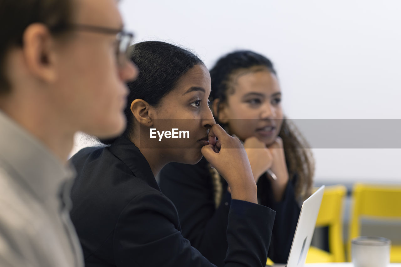 Business people having meeting in boardroom