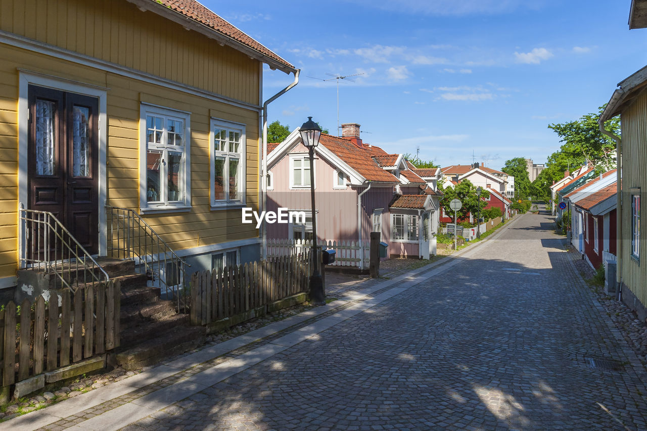 City street with old beautiful wooden houses