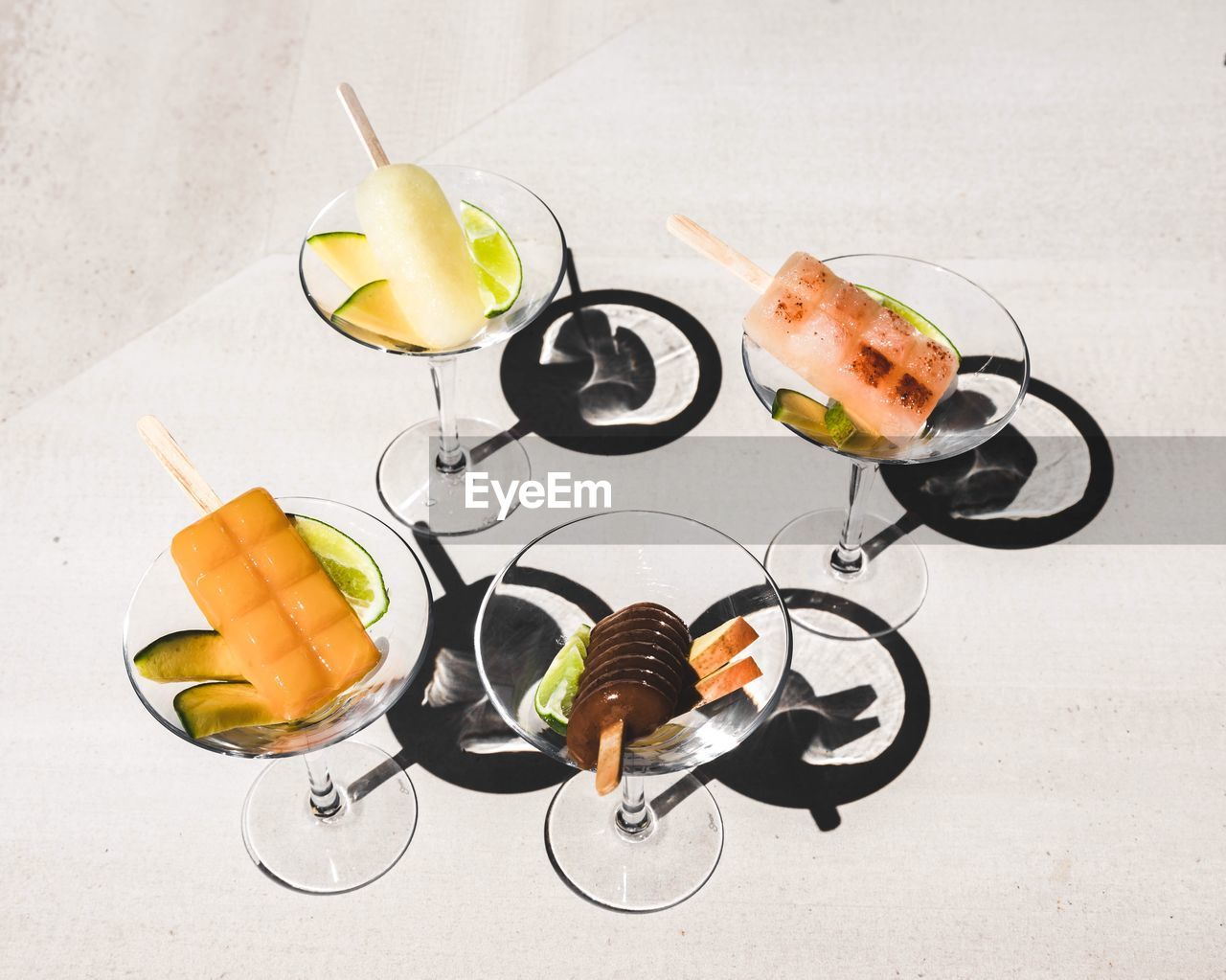 High angle view of ice creams in glasses on table