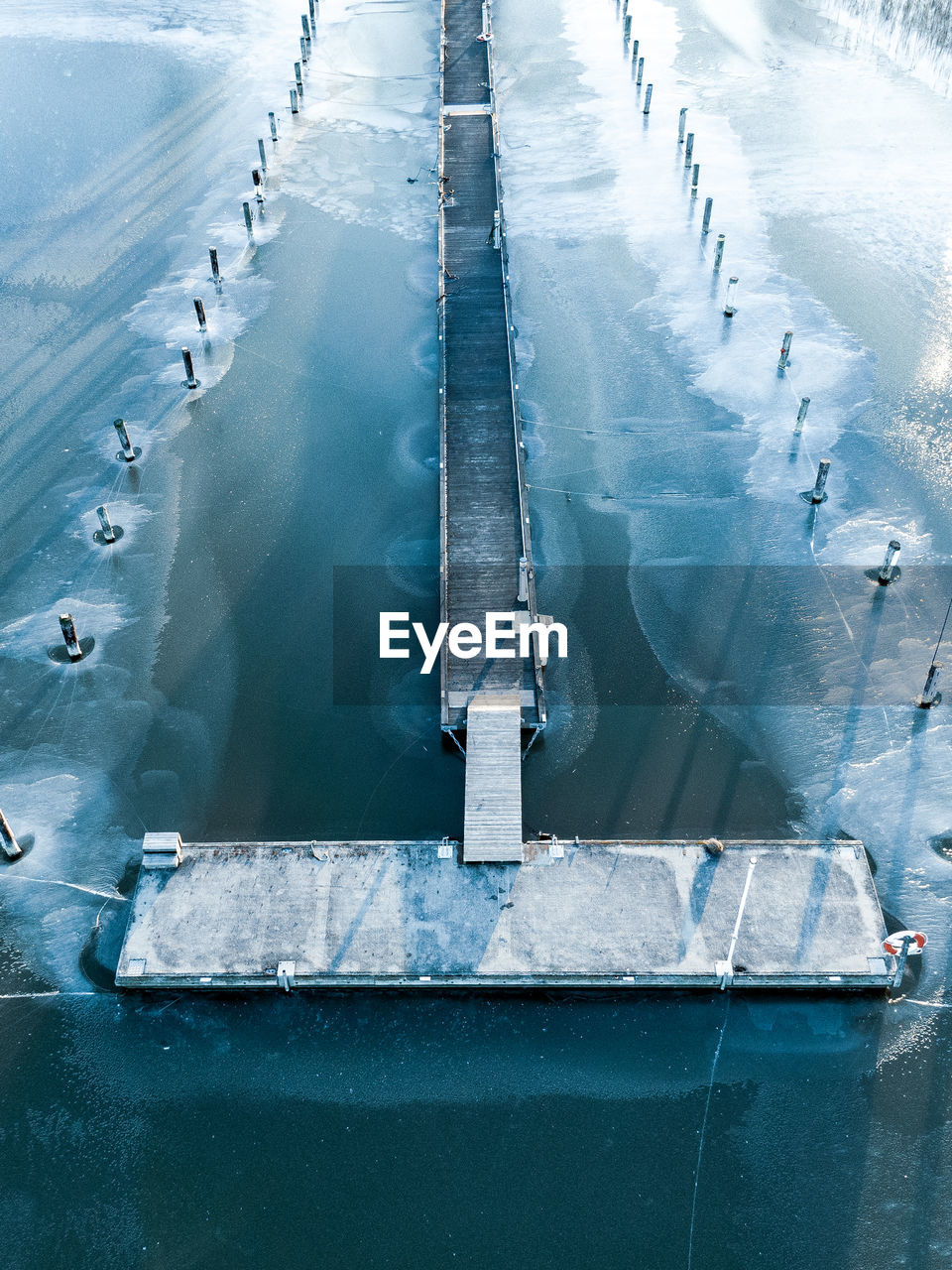 High angle view of pier on sea during winter