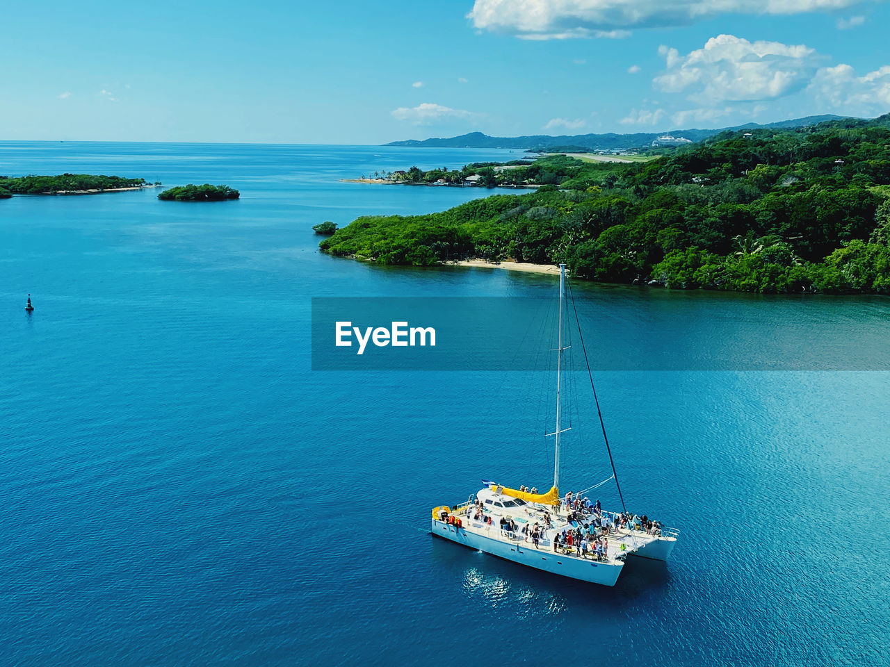 Sailboat on sea against sky