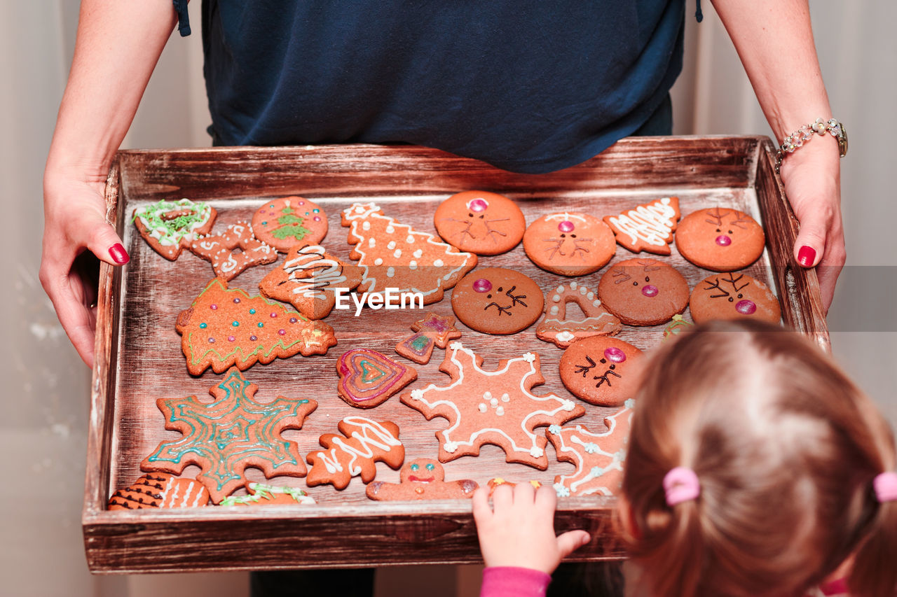 Close-up of girl looking at gingerbread cookies