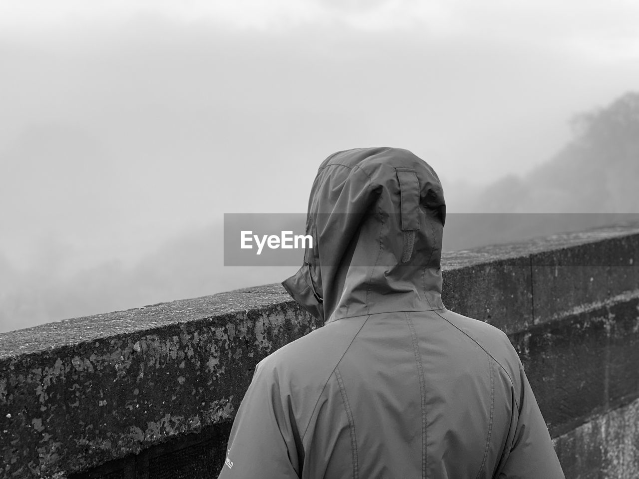 Rear view of woman standing against the sky