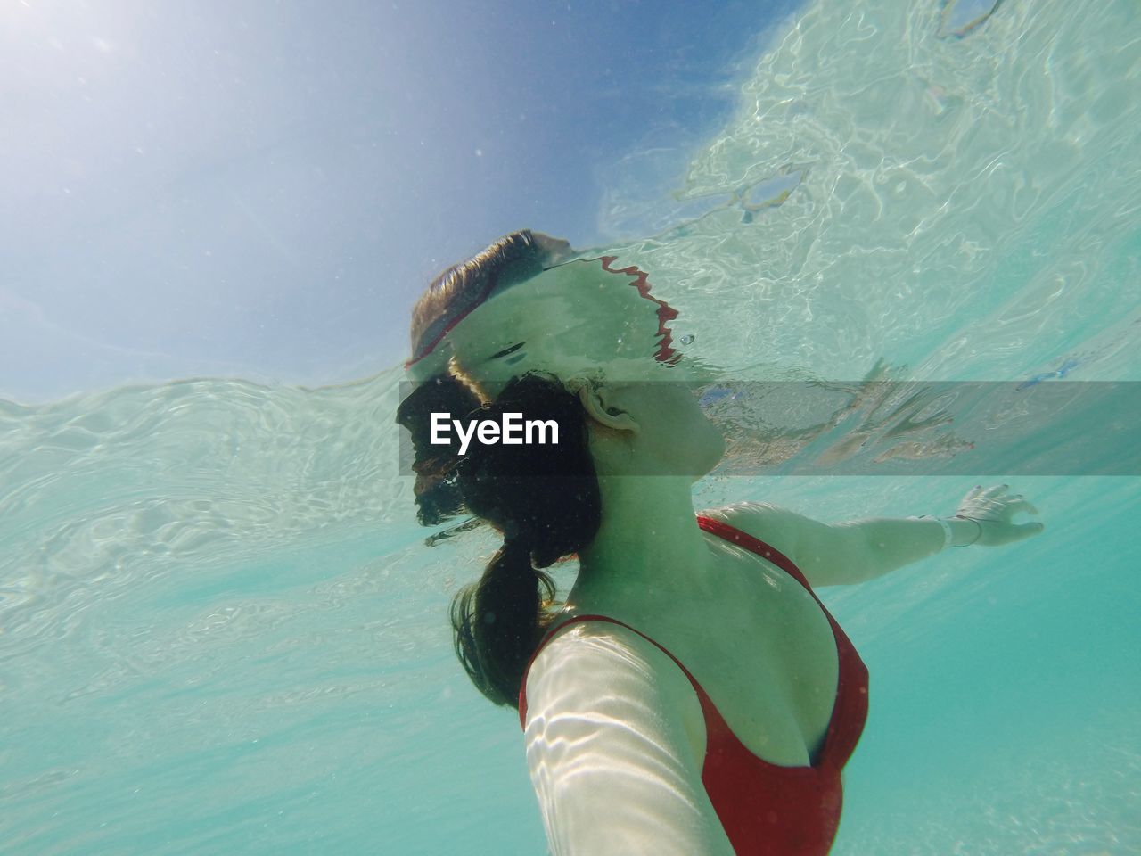 Low angle view of woman swimming