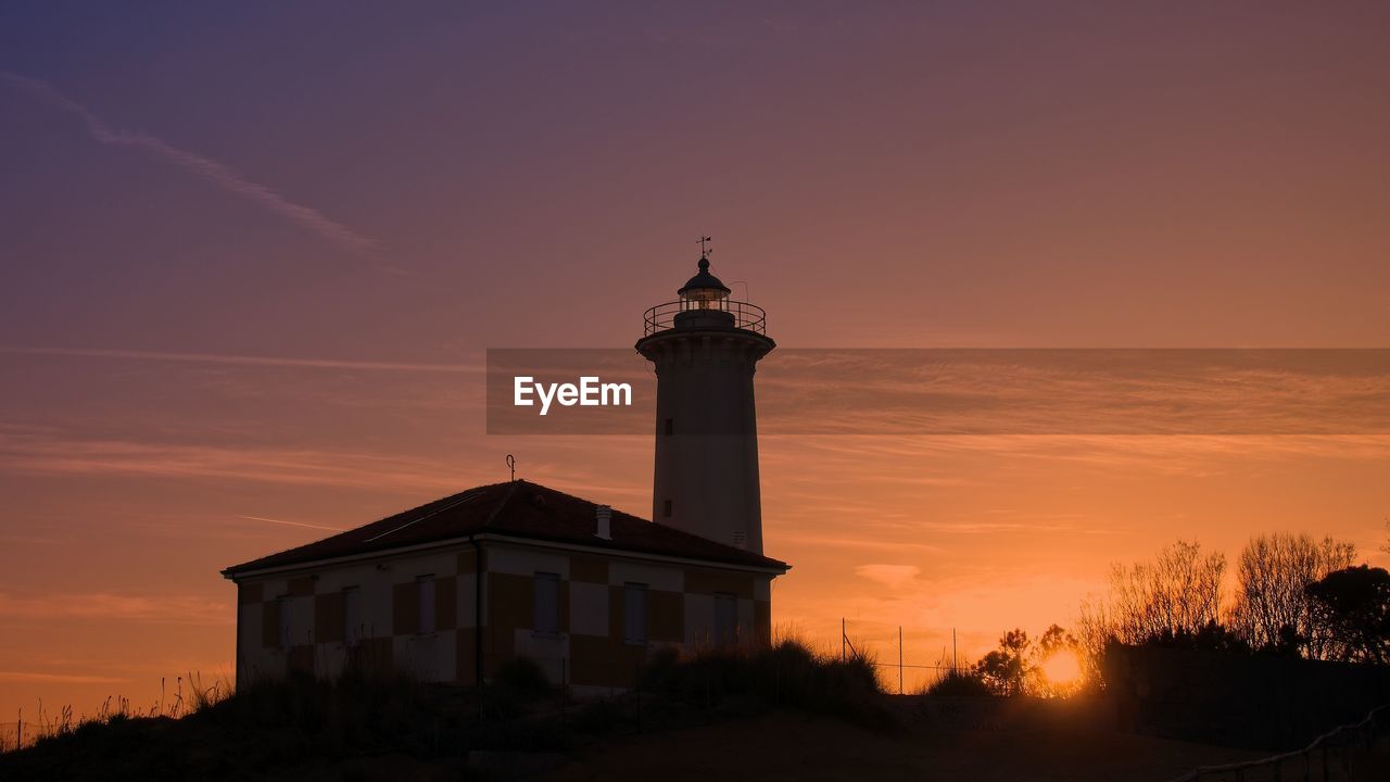 LIGHTHOUSE AGAINST SKY DURING SUNSET