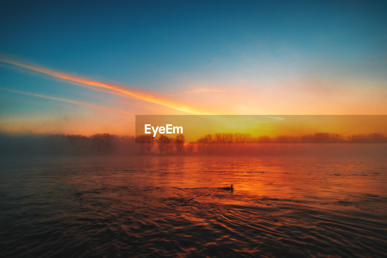 Scenic view of sea against sky during sunset