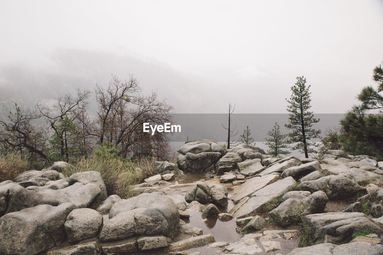 View of rocks in mountains against sky