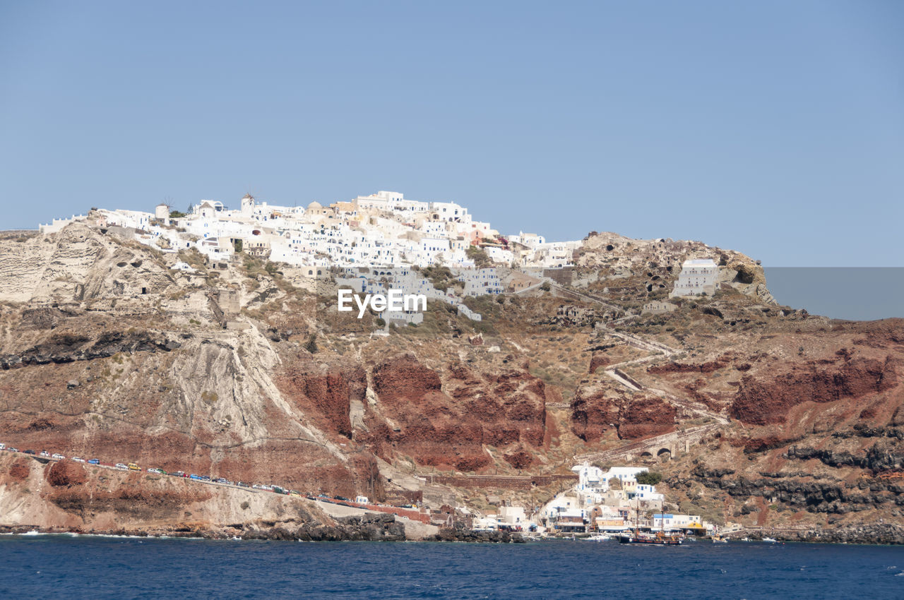 Panoramic view from the caldera of the seaside village of fira, santorini island, greece
