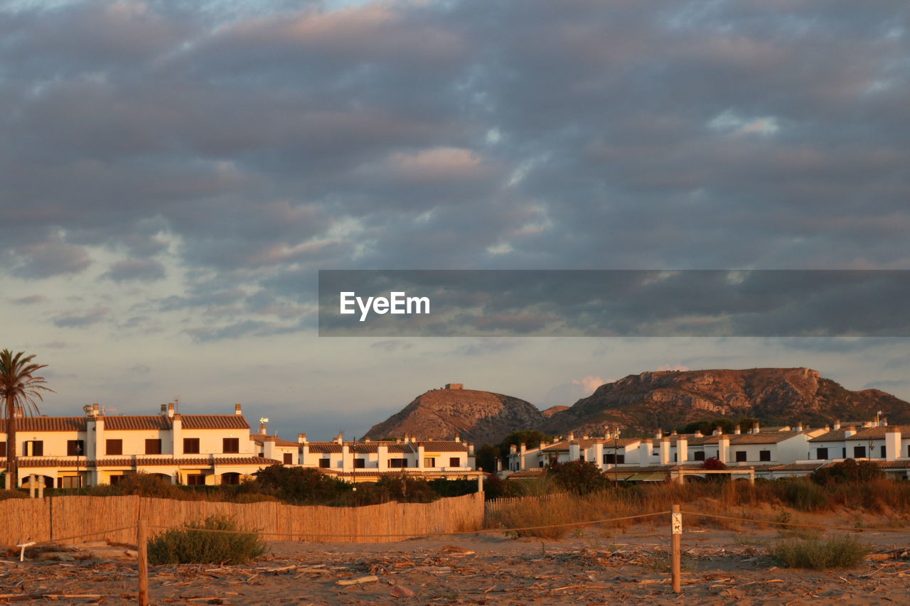 HOUSES AND BUILDINGS AGAINST SKY